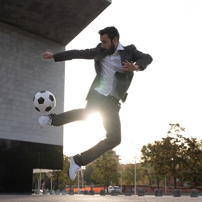 Business Man Playing Soccer